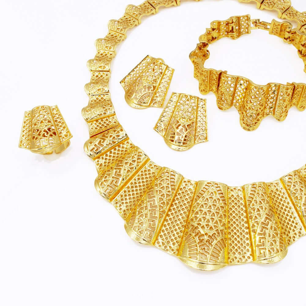Gold jewelry set including necklace, bracelet, and earrings on a white background