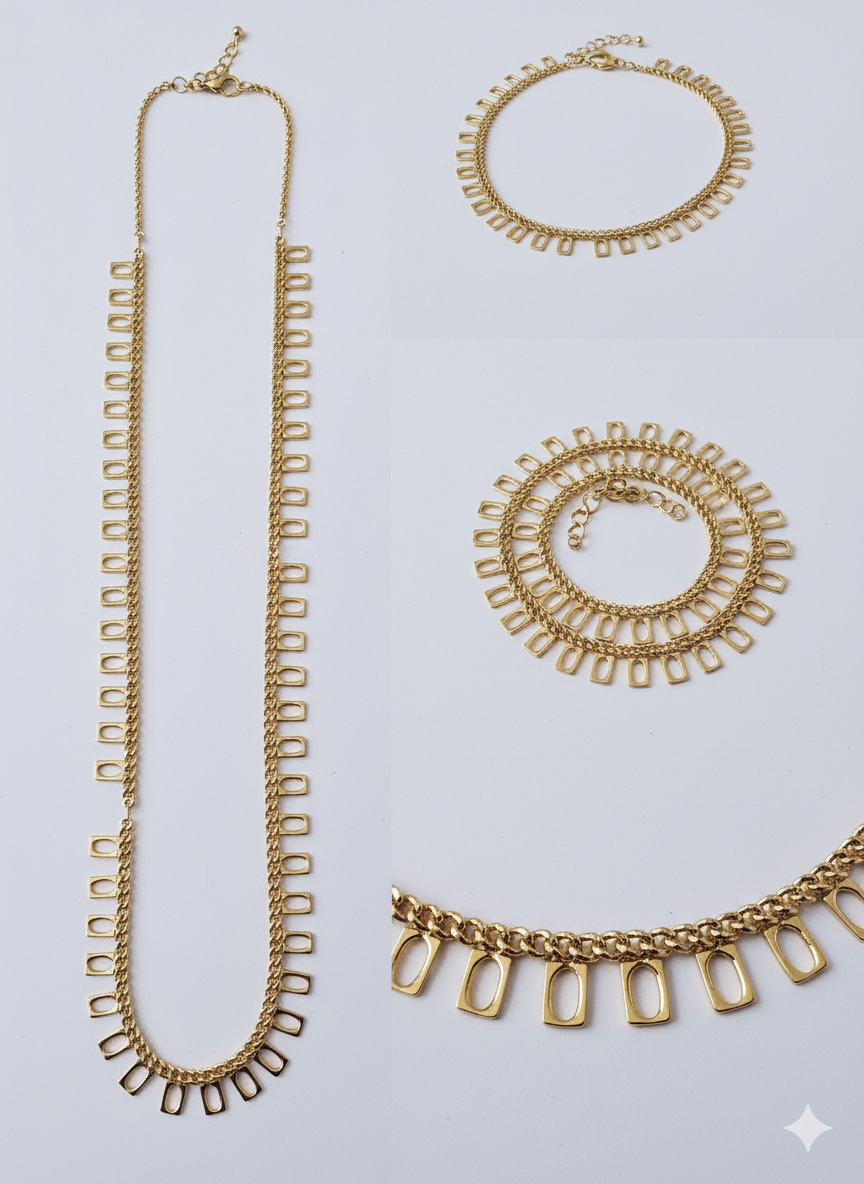 Gold necklaces and bracelets on a light gray background