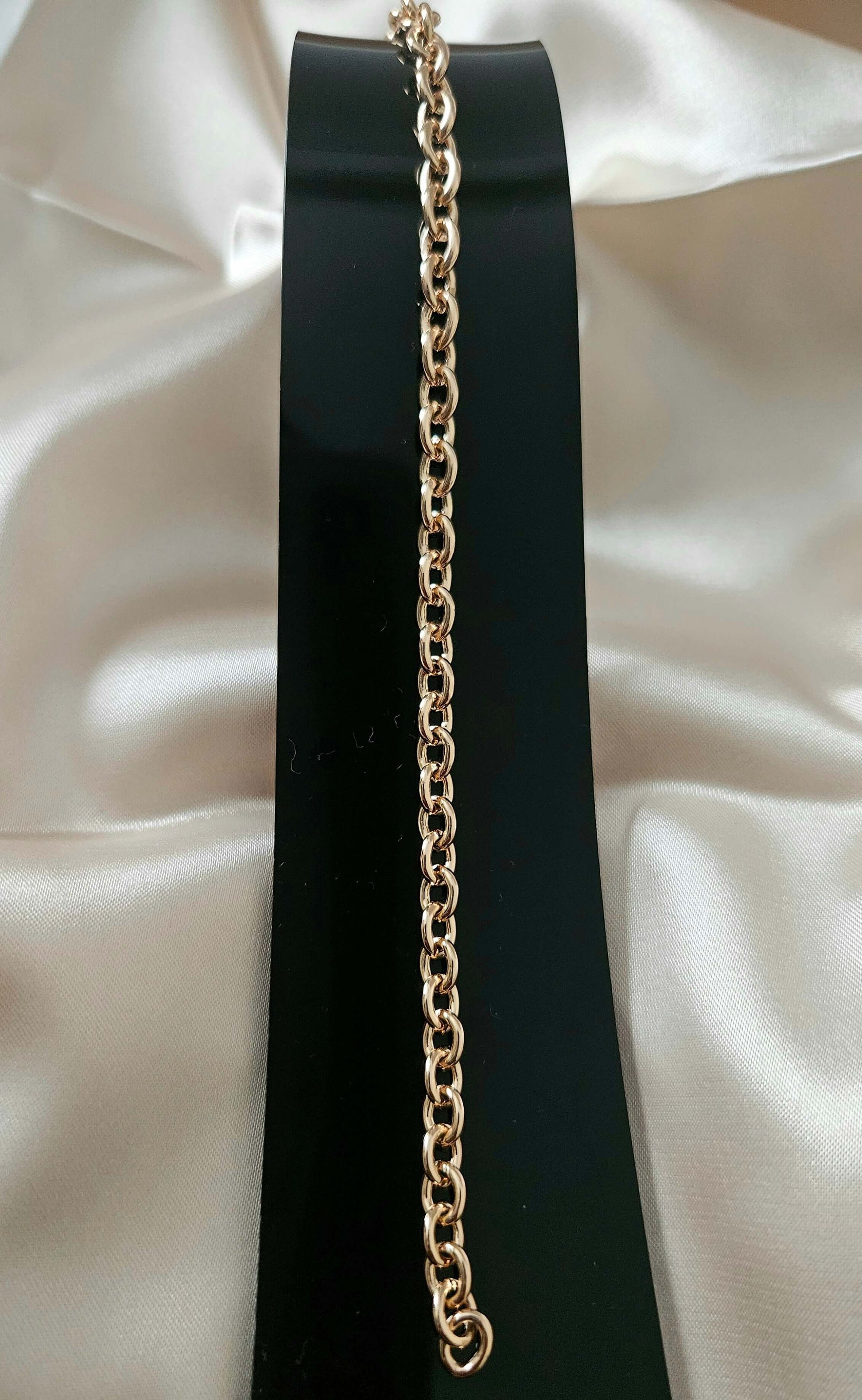 Gold chain on a black background