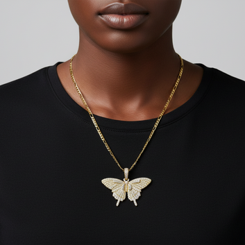 Person wearing a gold butterfly pendant necklace on a plain background