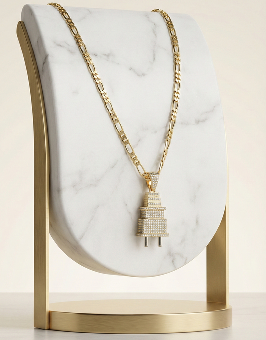 Gold necklace on a marble stand with a beige background