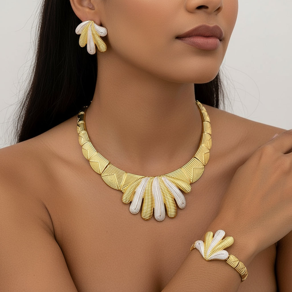 Woman wearing a gold and white necklace, earrings, and bracelet on a neutral background