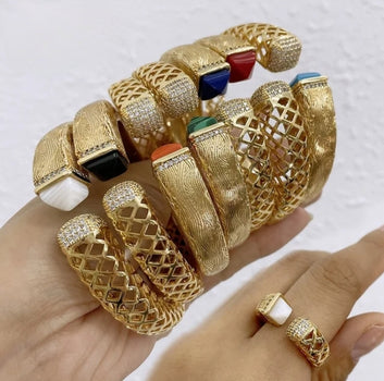 Khloe Bangle & Ring Set with colorful stones on a hand against a white background