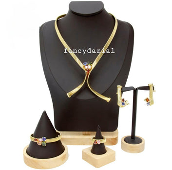 Jewelry set including a necklace, rings, and earrings displayed on a black mannequin bust.