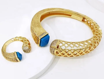 Khloe Bangle & Ring Set with colorful stones on a hand against a white background