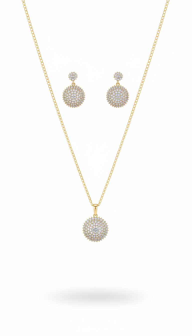 Gold necklace and earrings set on a white background