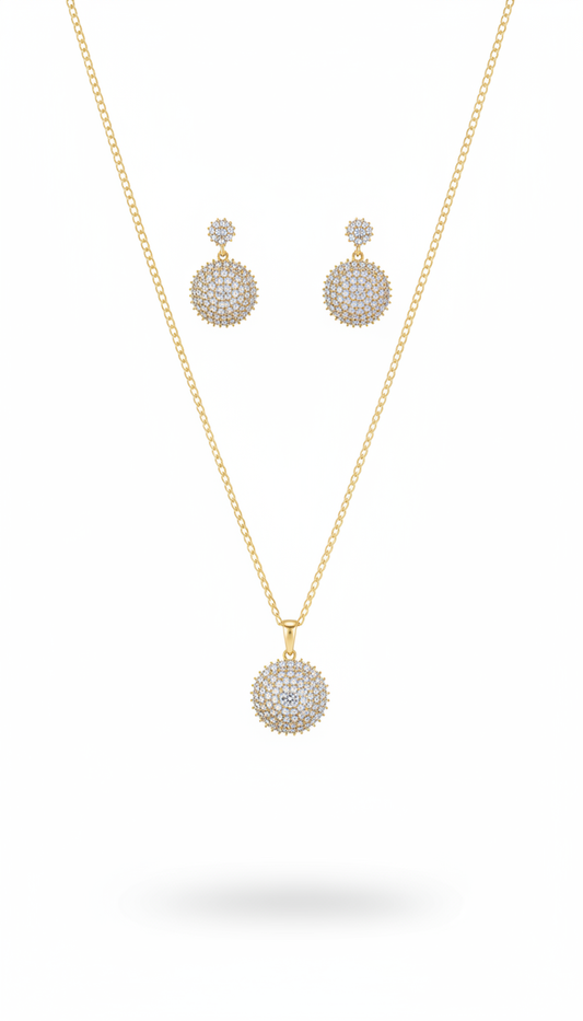Gold necklace and earrings set on a white background