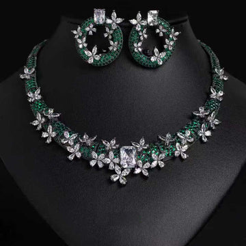 Jewelry set with necklace and earrings on a black background
