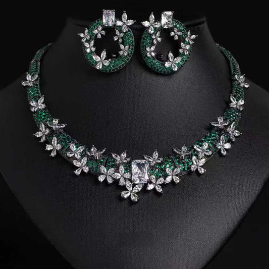 Jewelry set with necklace and earrings on a black background