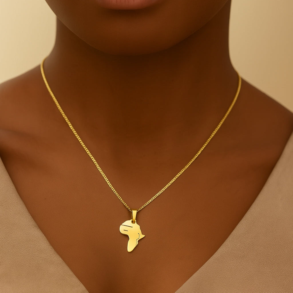 Gold necklace with a pendant worn by a person against a beige background