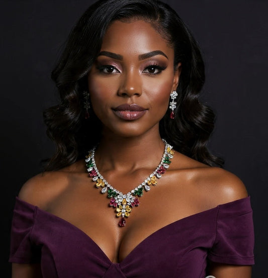 Woman wearing a colorful necklace and earrings against a dark background