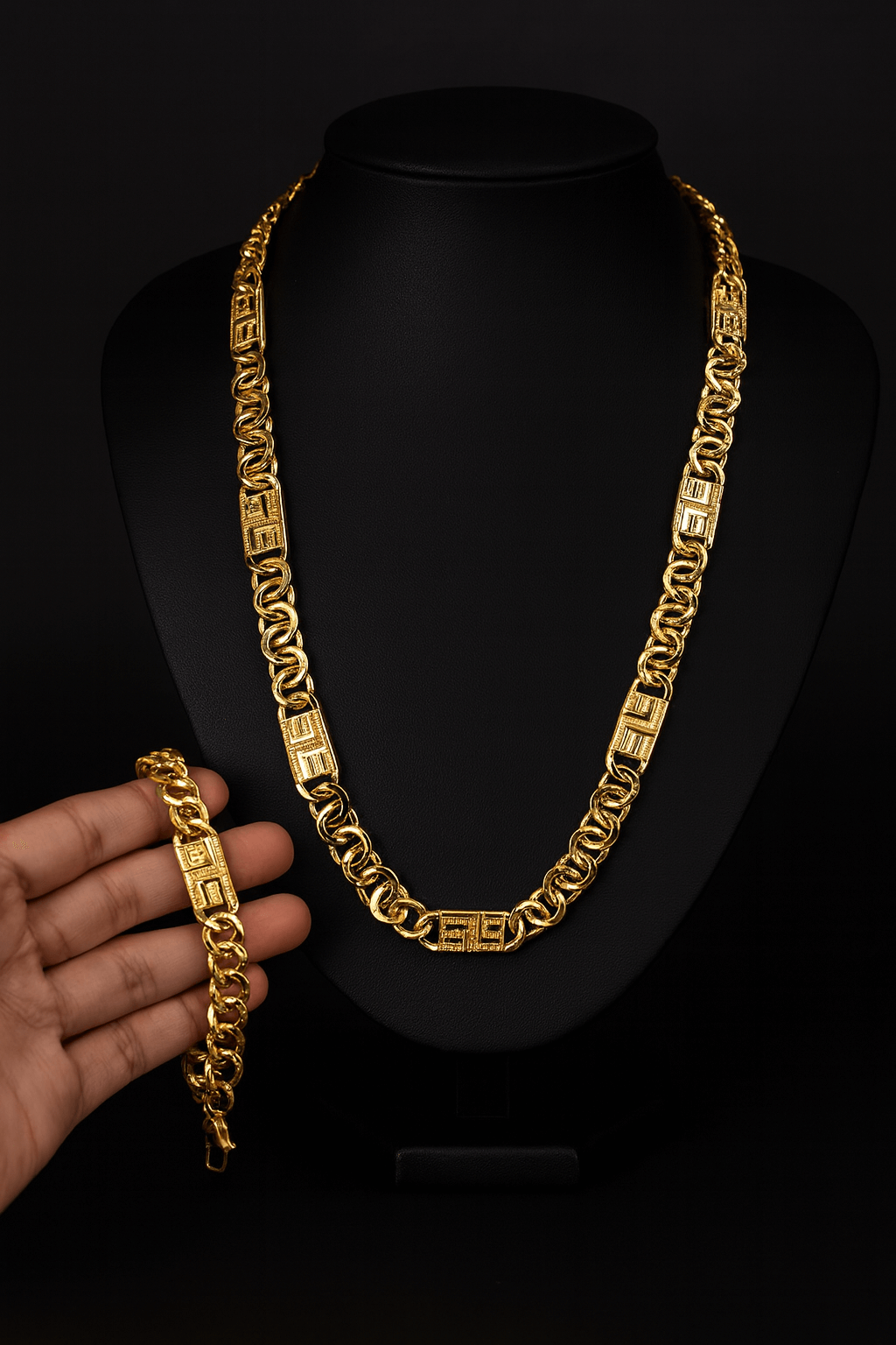 Prestige Unisex Cuban Gold Plated Necklace & Bracelet Set – FancyDaria displayed on a black bust with a hand holding the bracelet.