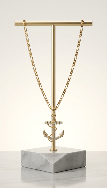 Gold-plated iced out anchor pendant necklace on marble display stand – Fancy Daria men's jewelry