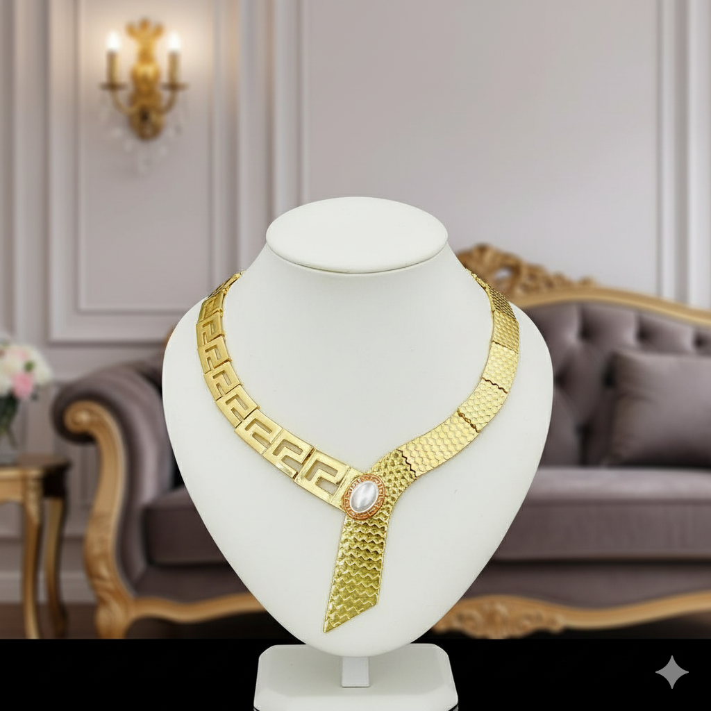 Gold necklace on a white mannequin bust with a luxurious interior background